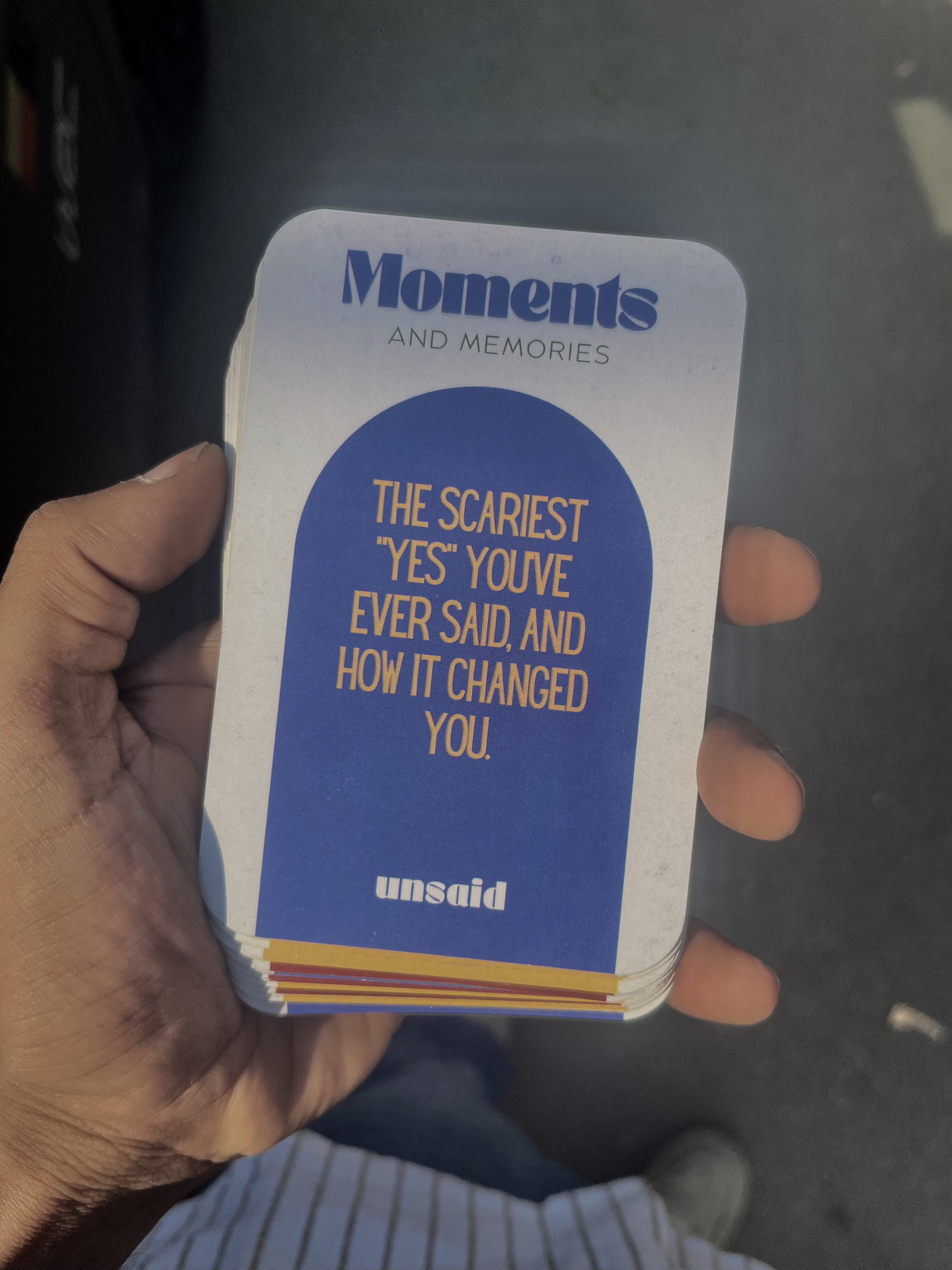 Unsaid prompt card held in someone's hand